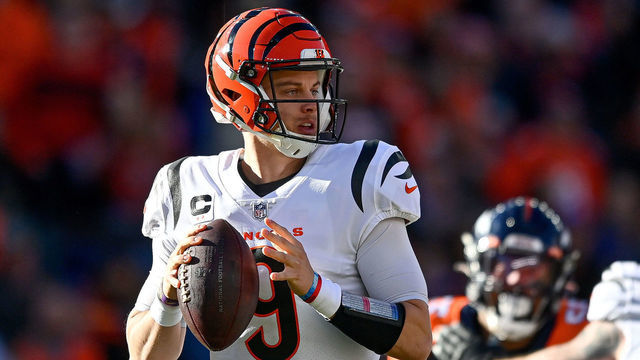 DENVER, CO - DECEMBER 19: Cincinnati Bengals quarterback Joe Burrow (9) sets to pass during a game between the Denver Broncos and the Cincinnati Bengals at Empower Field at Mile High on December 19, 2021 in Denver, Colorado.