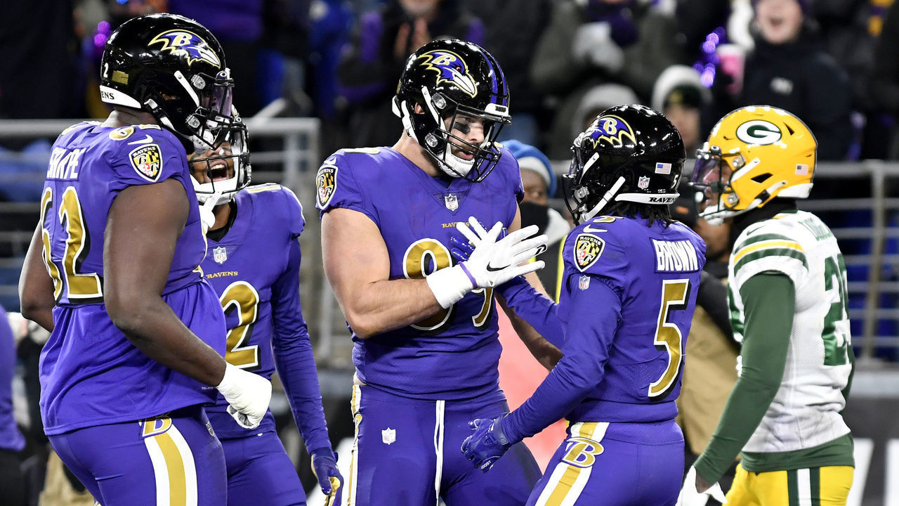 BALTIMORE, MD - DECEMBER 19: Baltimore Ravens tight end Mark Andrews (89) celebrates with wide receiver Marquise Hollywood Brown (5) after a second quarter touchdown catch during the Green Bay Packers versus Baltimore Ravens NFL game at M&T Bank Stadium on December 19, 2021 in Baltimore, MD.