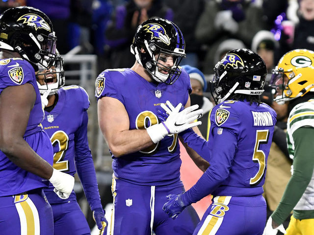 BALTIMORE, MD - DECEMBER 19: Baltimore Ravens tight end Mark Andrews (89) celebrates with wide receiver Marquise Hollywood Brown (5) after a second quarter touchdown catch during the Green Bay Packers versus Baltimore Ravens NFL game at M&T Bank Stadium on December 19, 2021 in Baltimore, MD.