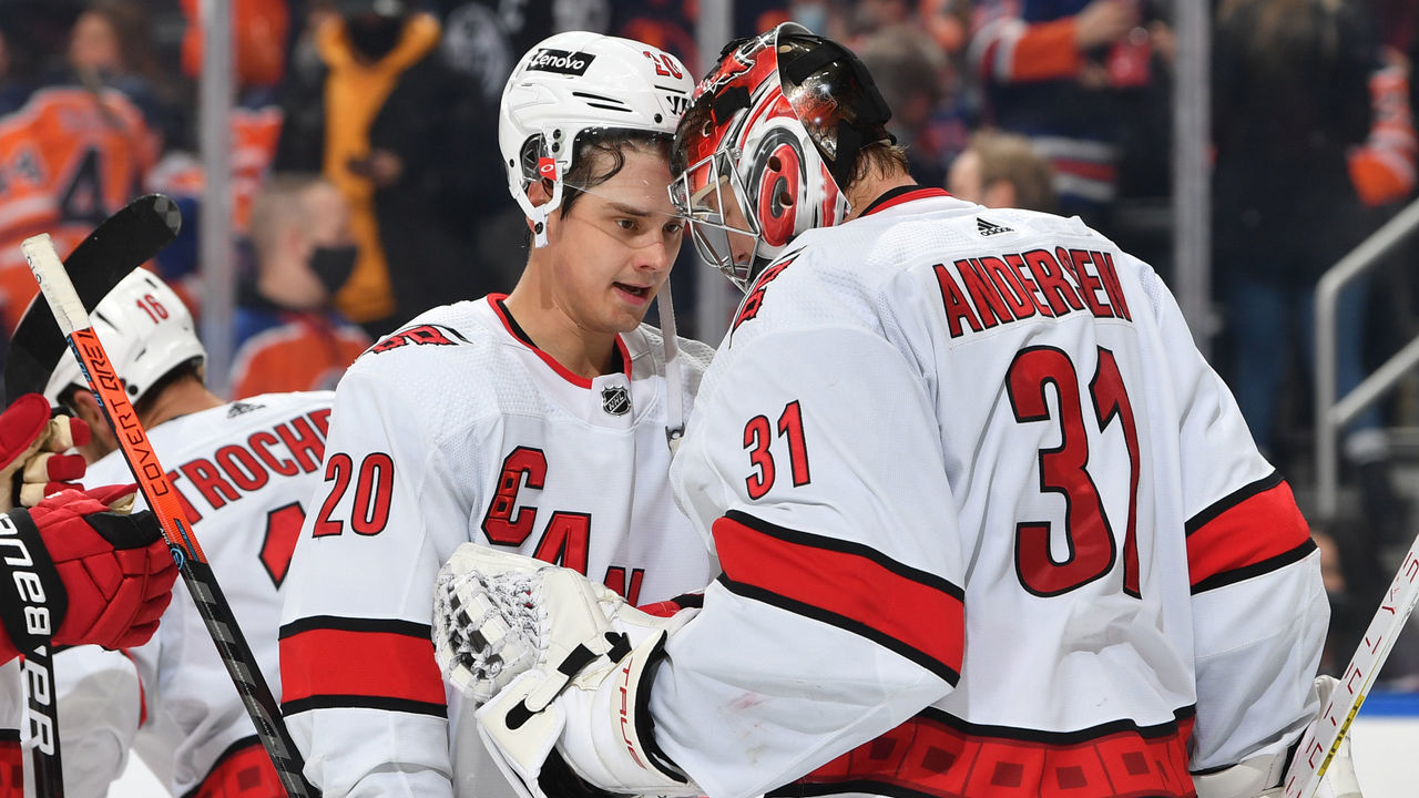 EDMONTON, AB - DECEMBER 11: Sebastian Aho #20 and Frederik Andersen #31 of the Carolina Hurricanes celebrate after winning the game against the Edmonton Oilers on December 11, 2021 at Rogers Place in Edmonton, Alberta, Canada.
