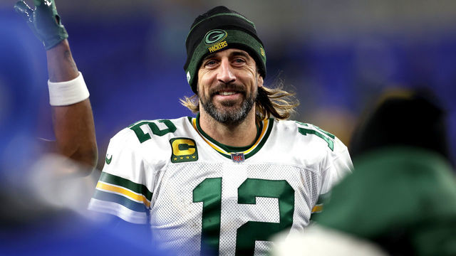 BALTIMORE, MARYLAND - DECEMBER 19: Aaron Rodgers #12 of the Green Bay Packers smiles as he walks off the field after their game against the Baltimore Ravens at M&T Bank Stadium on December 19, 2021 in Baltimore, Maryland.