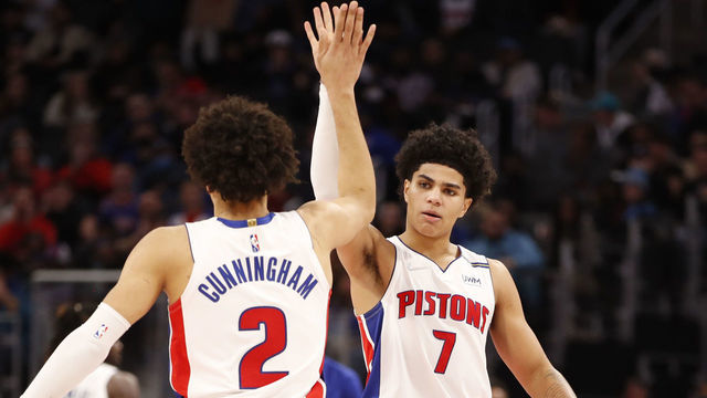 DETROIT, MI - DECEMBER 19: Killian Hayes #7 hi-fives Cade Cunningham #2 of the Detroit Pistons during the game against the Miami Heat on December 19, 2021 at Little Caesars Arena in Detroit, Michigan. NOTE TO USER: User expressly acknowledges and agrees that, by downloading and/or using this photograph, User is consenting to the terms and conditions of the Getty Images License Agreement. Mandatory Copyright Notice: Copyright 2021 NBAE