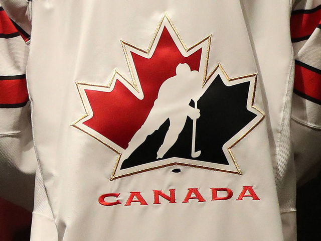 TORONTO, ON- AUGUST 2 - Head of Hockey Canada Thomas "Tom" Renney shows off the new Team Canada Jersey. Rows of Maple Leaf icons fill the jersey's shoulder caps. The jersey also sports the Canada 150 logo. The Jersey is made with ripstop fabric to resist ripping. Nike unveils a new hockey jersey design for the National Team programs leading into the World Cup of Hockey in Toronto. August 2, 2016. (Steve Russell/Toronto Star via Getty Images)