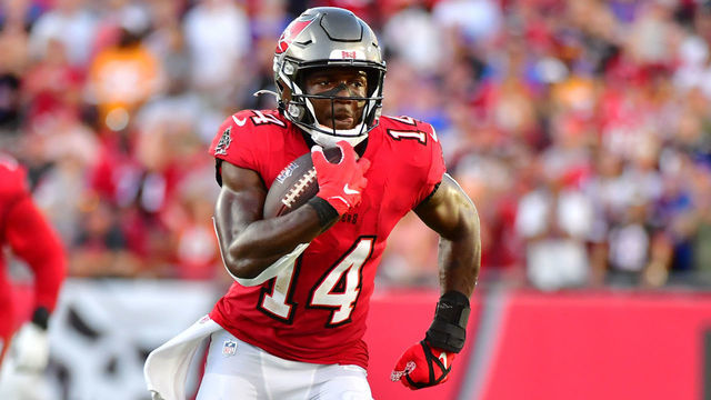TAMPA, FLORIDA - DECEMBER 12: Chris Godwin #14 of the Tampa Bay Buccaneers runs with the ball during the first half against the Buffalo Bills at Raymond James Stadium on December 12, 2021 in Tampa, Florida.