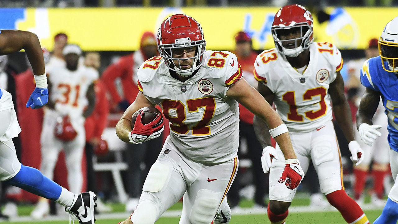 INGLEWOOD, CALIFORNIA - DECEMBER 16: (EDITOR'S NOTE: Alternate crop) Travis Kelce #87 of the Kansas City Chiefs carries the ball for a touchdown during overtime against the Los Angeles Chargers at SoFi Stadium on December 16, 2021 in Inglewood, California.