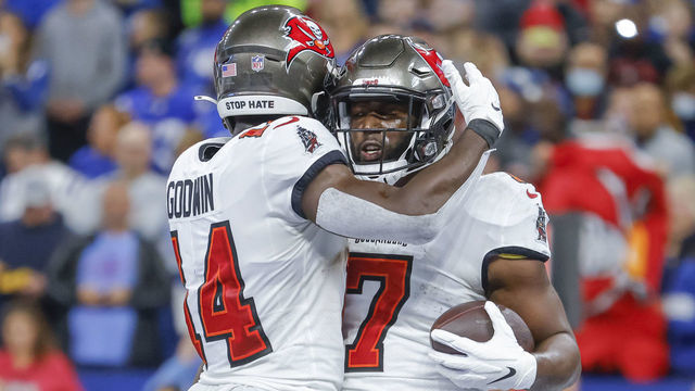 INDIANAPOLIS, IN - NOVEMBER 28: Chris Godwin #14 and Leonard Fournette #7 of the Tampa Bay Buccaneers celebrate during the game against the Indianapolis Colts at Lucas Oil Stadium on November 28, 2021 in Indianapolis, Indiana.