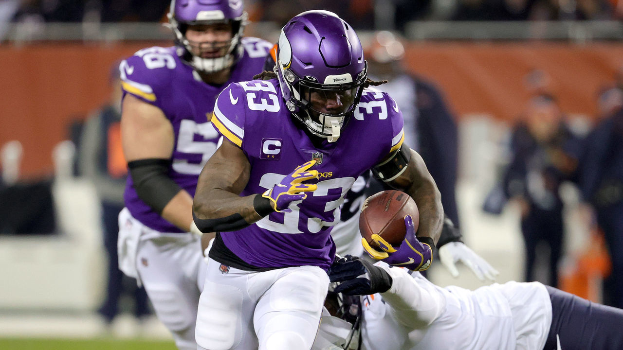 CHICAGO, ILLINOIS - DECEMBER 20: Dalvin Cook #33 of the Minnesota Vikings carries the ball during the first half against the Chicago Bears at Soldier Field on December 20, 2021 in Chicago, Illinois.