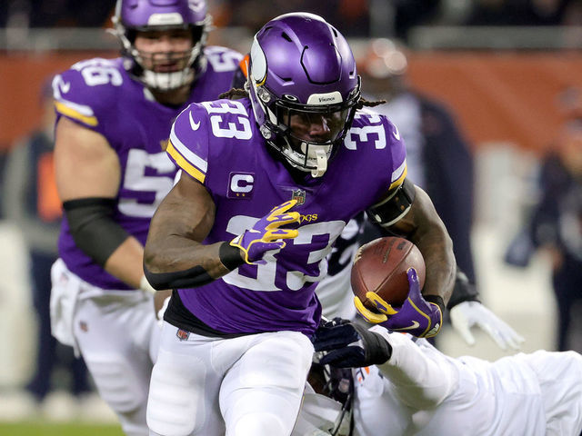 CHICAGO, ILLINOIS - DECEMBER 20: Dalvin Cook #33 of the Minnesota Vikings carries the ball during the first half against the Chicago Bears at Soldier Field on December 20, 2021 in Chicago, Illinois.