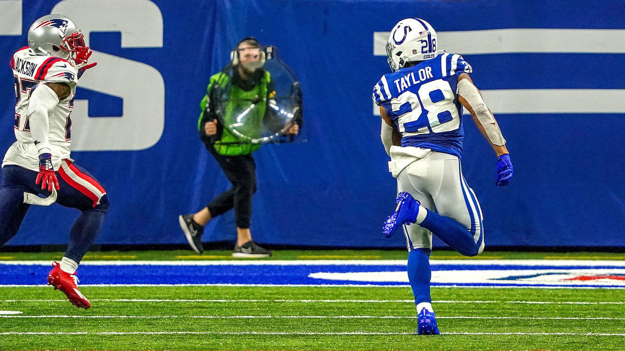 Indianapolis, IN - December 18: Indianapolis Colts running back Jonathan Taylor (28) put the nail in the coffin with his late run for a touchdown to put the Colts up 27-17 late in the fourth quarter. The Indianapolis Colts host the New England Patriots on December 18, 2021 in a Saturday night NFL game at Lucas Oil Stadium in Indianapolis, IN.