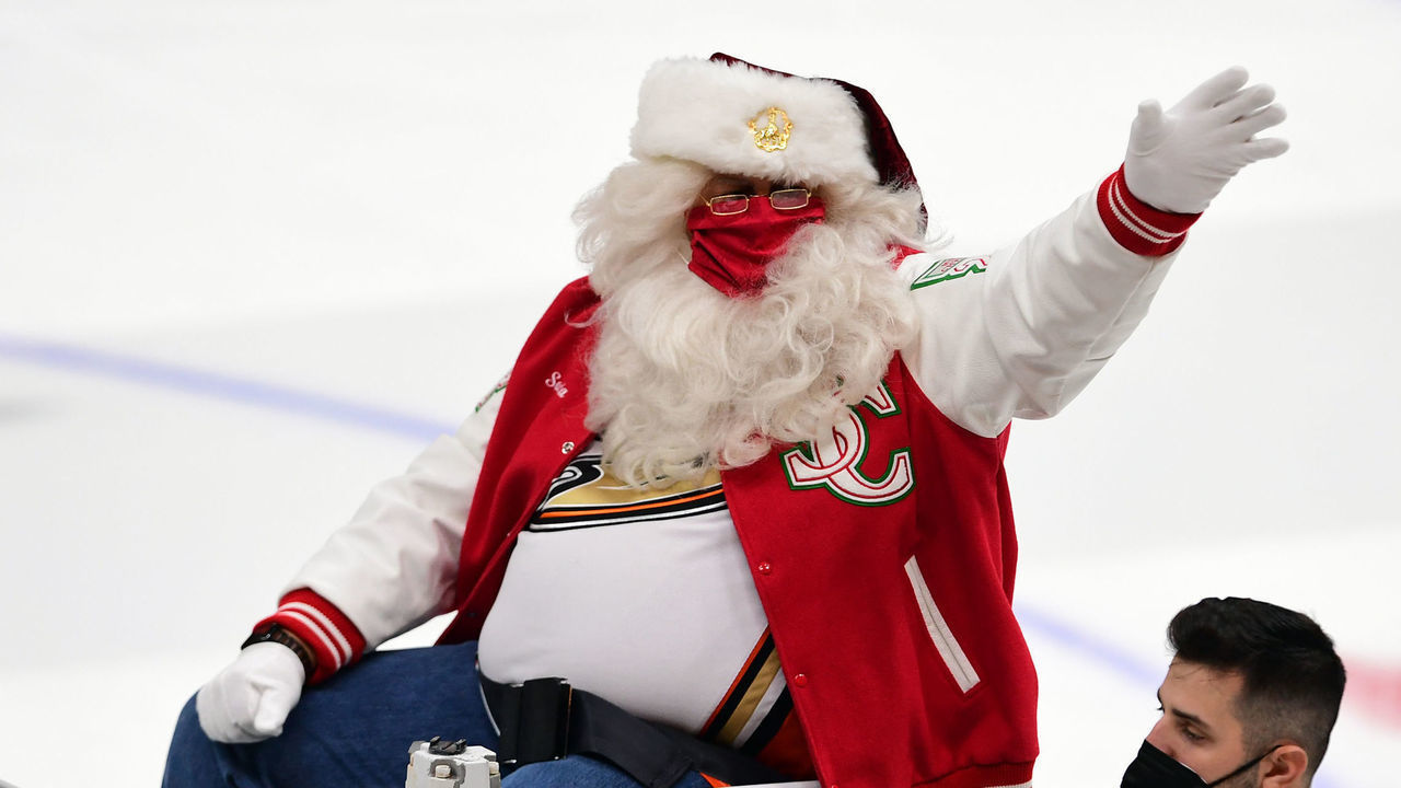 ANAHEIM, CA - DECEMBER 15: Santa Claus waves to the fans from a Zamboni before the start of a hockey game between the Seattle Kraken and the Anaheim Ducks played on December 15, 2021 at the Honda Center in Anaheim, CA.