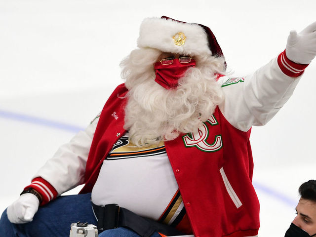 ANAHEIM, CA - DECEMBER 15: Santa Claus waves to the fans from a Zamboni before the start of a hockey game between the Seattle Kraken and the Anaheim Ducks played on December 15, 2021 at the Honda Center in Anaheim, CA.