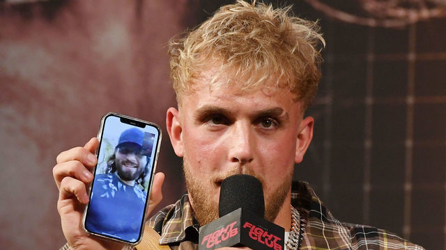 LAS VEGAS, NEVADA - MARCH 26: Jake Paul talks to mixed martial artist Jorge Masvidal on his cell phone during a news conference for Triller Fight Club's inaugural 2021 boxing event at The Venetian Las Vegas on March 26, 2021 in Las Vegas, Nevada. Paul will face Ben Askren, who was knocked out by Masvidal in UFC 239 in 2019, in the main event that will take place on April 17, 2021, at Mercedes-Benz Stadium in Atlanta.