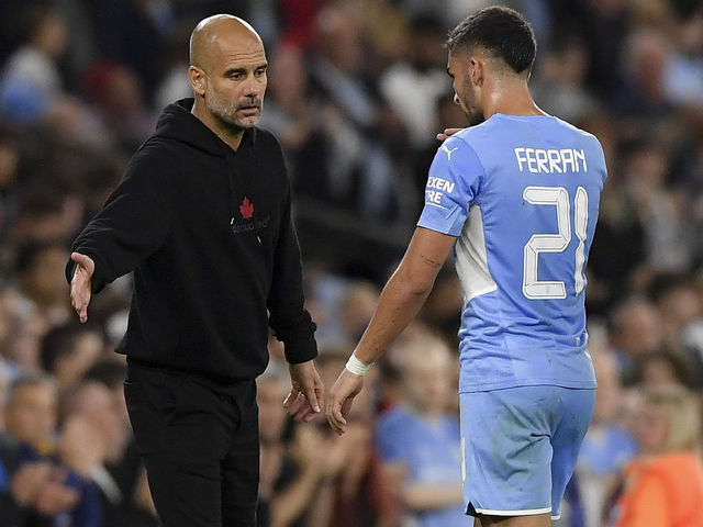 MANCHESTER, ENGLAND - SEPTEMBER 15: (BILD OUT) head coach Pep Guardiola of Manchester City and Ferran Torres of Manchester City gestures during the UEFA Champions League group A match between Manchester City and RB Leipzig at Etihad Stadium on September 15, 2021 in Manchester, United Kingdom.