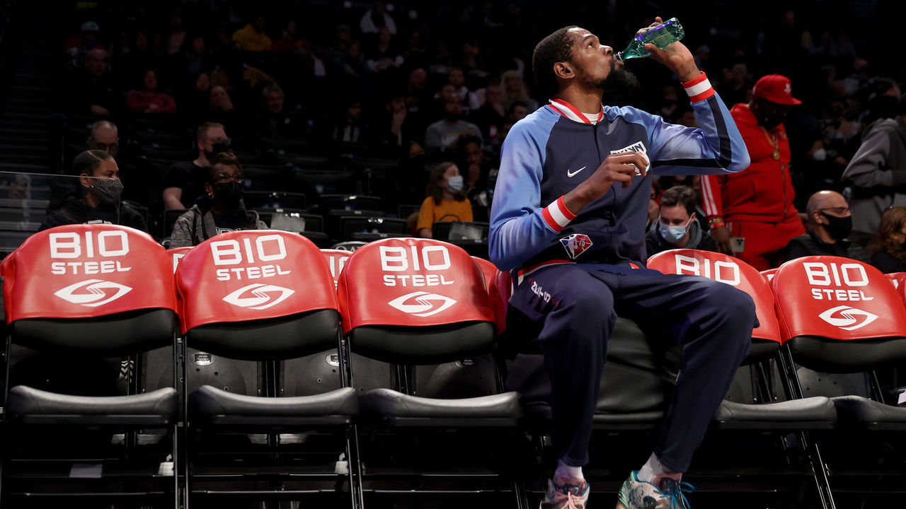 NEW YORK, NEW YORK - DECEMBER 03: Kevin Durant #7 of the Brooklyn Nets sits on the bench during warm ups before the game against the Minnesota Timberwolves at Barclays Center on December 03, 2021 in the Brooklyn borough of New York City.