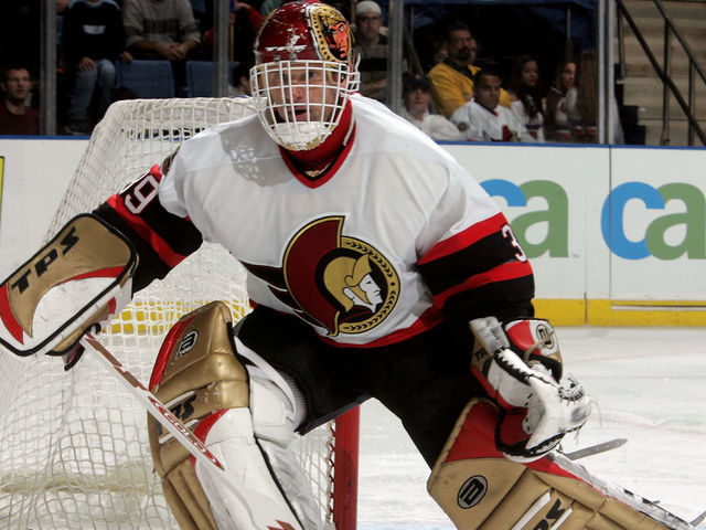 UNIONDALE, NY - NOVEMBER 25: Goaltender Dominik Hasek #39 of the Ottawa Senators looks to play the puck against the New York Islanders during their game on November 25, 2005 at Nassau Coliseum in Uniondale, New York. The Sens defeated the Isles 6-2.