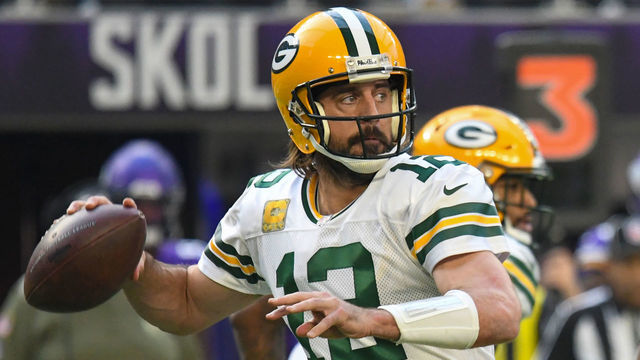 MINNEAPOLIS, MN - NOVEMBER 21: Green Bay Packers Quarterback Aaron Rodgers (12) makes a pass during a game between the Minnesota Vikings and Green Bay Packers on November 21, 2021, at U.S. Bank Stadium in Minneapolis, MN.