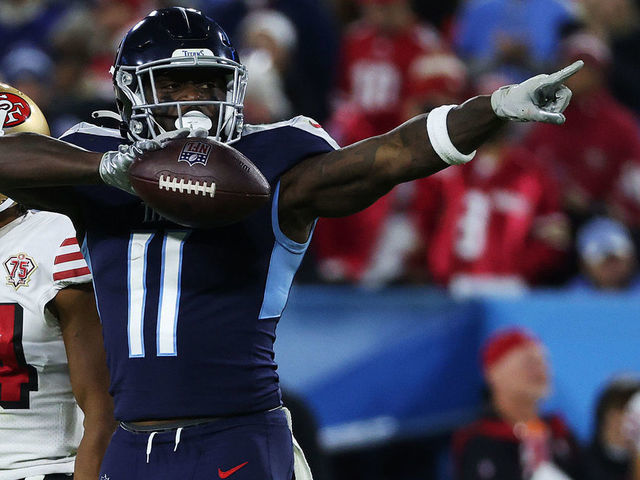 NASHVILLE, TENNESSEE - DECEMBER 23: A.J. Brown #11 of the Tennessee Titans reacts after a first down reception during the third quarter against the San Francisco 49ers at Nissan Stadium on December 23, 2021 in Nashville, Tennessee.