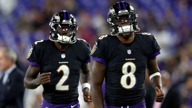 BALTIMORE, MARYLAND - OCTOBER 11: Lamar Jackson #8 and Tyler Huntley #2 of the Baltimore Ravens warm up before a game against the Indianapolis Colts at M&T Bank Stadium on October 11, 2021 in Baltimore, Maryland.