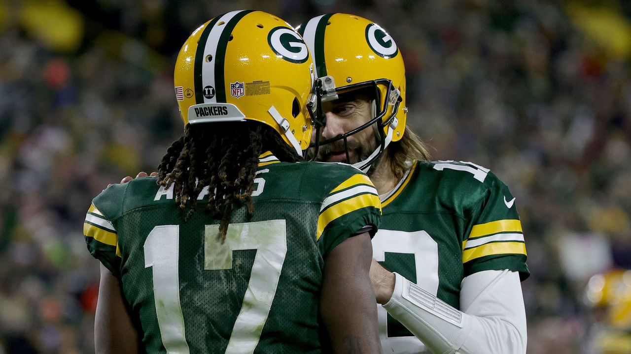 GREEN BAY, WISCONSIN - DECEMBER 25: Davante Adams #17 and Aaron Rodgers #12 of the Green Bay Packers celebrate after scoring a touchdown in the second quarter against the Cleveland Browns at Lambeau Field on December 25, 2021 in Green Bay, Wisconsin.