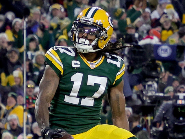GREEN BAY, WISCONSIN - DECEMBER 25: Davante Adams #17 of the Green Bay Packers celebrates after scoring a touchdown in the second quarter against the Cleveland Browns at Lambeau Field on December 25, 2021 in Green Bay, Wisconsin.