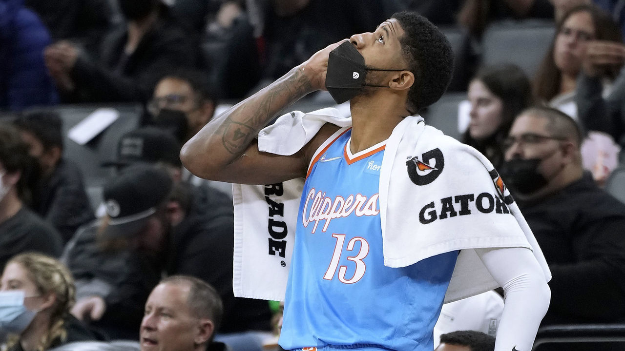 SACRAMENTO, CALIFORNIA - DECEMBER 22: Paul George #13 of the LA Clippers stands at the scorers table waiting to come into the game against the Sacramento Kings during the second quarter at Golden 1 Center on December 22, 2021 in Sacramento, California.
