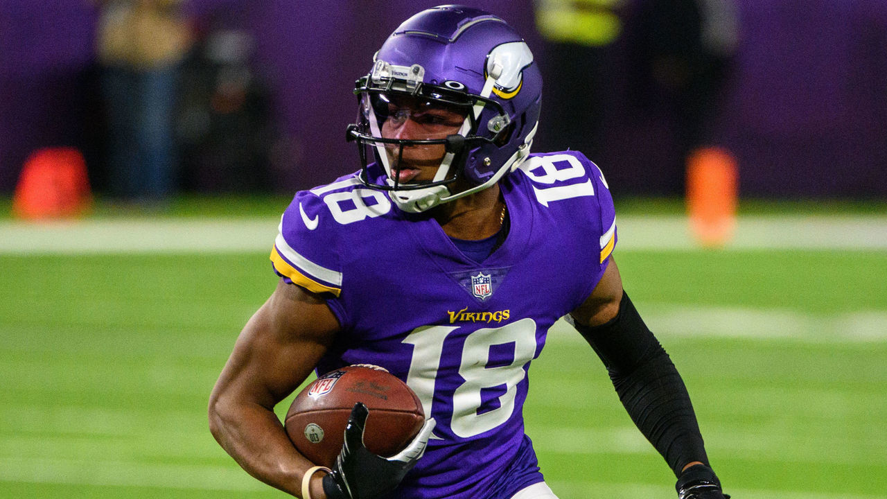 MINNEAPOLIS, MN - OCTOBER 31: Justin Jefferson #18 of the Minnesota Vikings runs with the ball in the first quarter the game against the Dallas Cowboys at U.S. Bank Stadium on October 31, 2021 in Minneapolis, Minnesota.