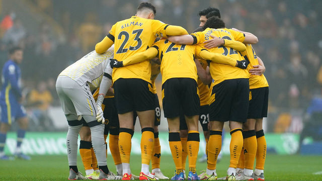 A general view Wolverhampton Wanderers' players forming a huddle before the Premier League match at the Molineux stadium, Wolverhampton. Picture date: Sunday December 19, 2021.
