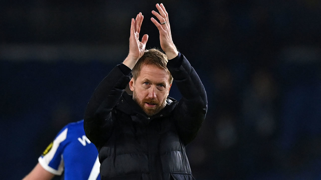 Brighton's English manager Graham Potter applauds supporters on the pitch after the English Premier League football match between Brighton and Hove Albion and Brentford at the American Express Community Stadium in Brighton, southern England on December 26, 2021. - Brighton won the game 2-0. - RESTRICTED TO EDITORIAL USE. No use with unauthorized audio, video, data, fixture lists, club/league logos or 'live' services. Online in-match use limited to 120 images. An additional 40 images may be used in extra time. No video emulation. Social media in-match use limited to 120 images. An additional 40 images may be used in extra time. No use in betting publications, games or single club/league/player publications.