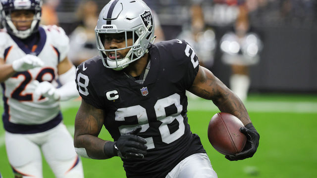LAS VEGAS, NEVADA - DECEMBER 26: Josh Jacobs #28 of the Las Vegas Raiders runs with the ball against the Denver Broncos in the first quarter at Allegiant Stadium on December 26, 2021 in Las Vegas, Nevada.