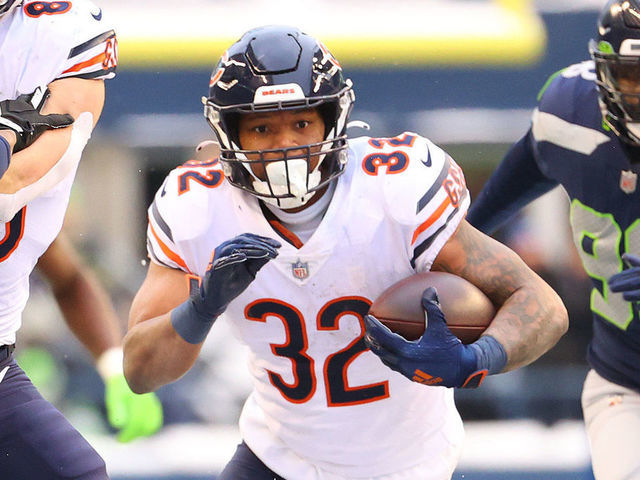 SEATTLE, WASHINGTON - DECEMBER 26: David Montgomery #32 of the Chicago Bears runs the ball during the third quarter against the Seattle Seahawks at Lumen Field on December 26, 2021 in Seattle, Washington.