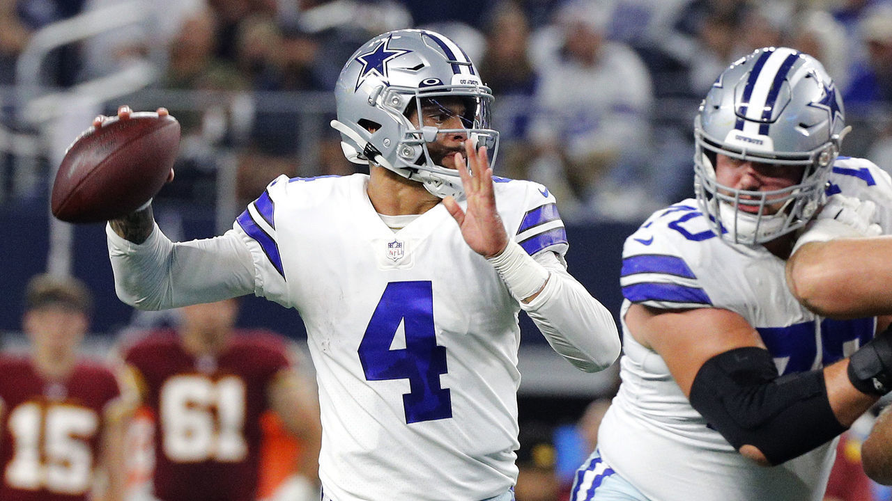 ARLINGTON, TEXAS - DECEMBER 26: Dak Prescott #4 of the Dallas Cowboys throws a pass during the first quarter against the Washington Football Team at AT&T Stadium on December 26, 2021 in Arlington, Texas.
