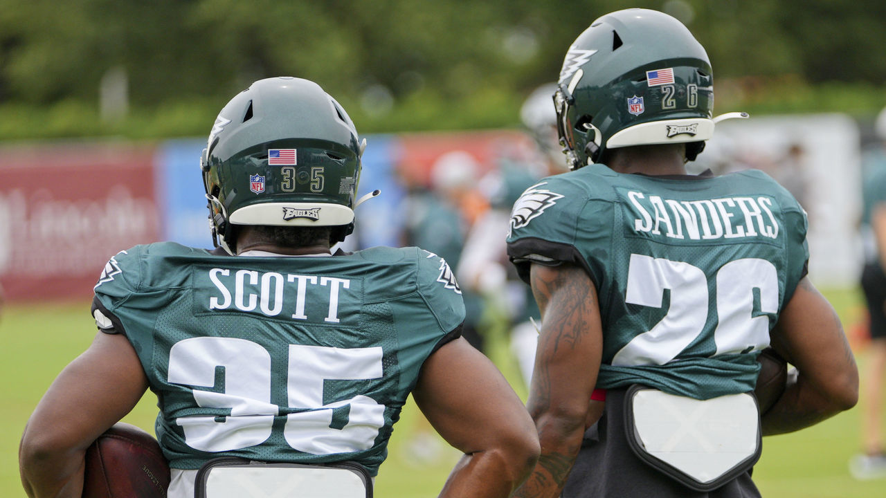 PHILADELPHIA, PA - AUGUST 03: Philadelphia Eagles running back Boston Scott (35) and Philadelphia Eagles running back Miles Sanders (26) look on during the Philadelphia Eagles training camp on August 03, 2021 at NovaCare Training Complex in Philadelphia ,PA.