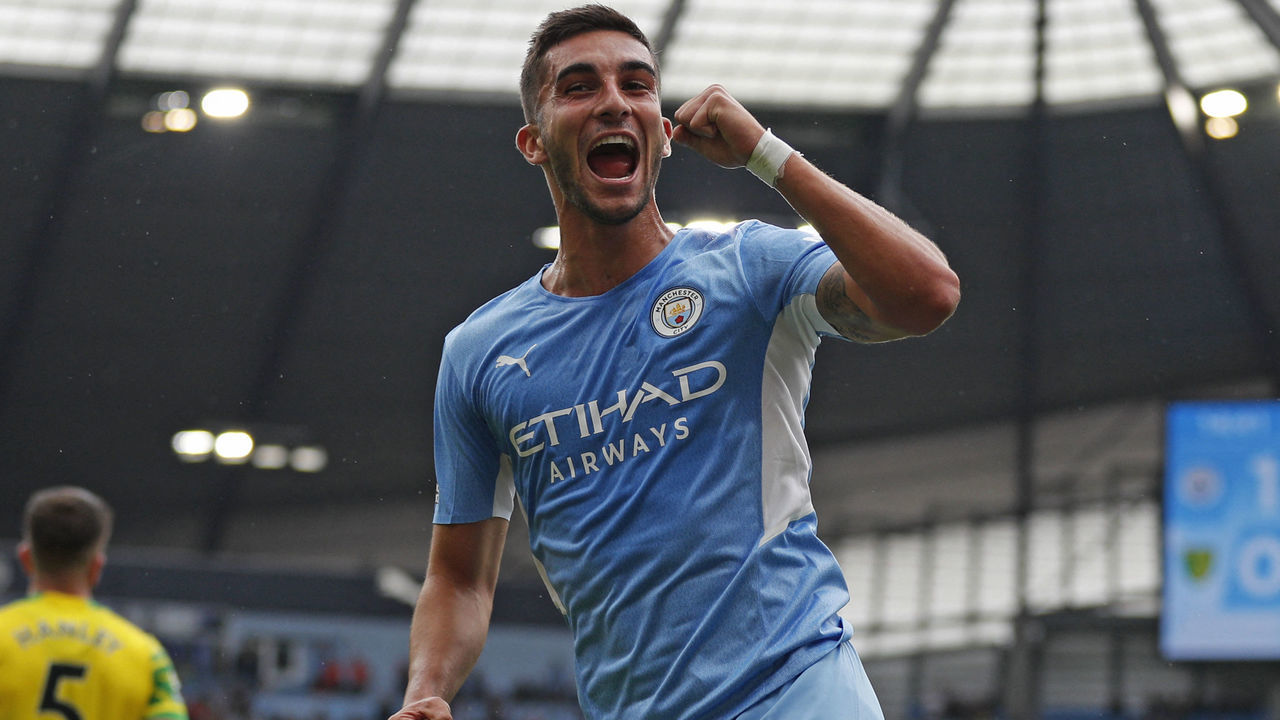 Manchester City's Spanish midfielder Ferran Torres celebrates after scoring but after a VAR (Video Assistant Referee) review it is disallowed during the English Premier League football match between Manchester City and Norwich City at the Etihad Stadium in Manchester, north west England, on August 21, 2021. - RESTRICTED TO EDITORIAL USE. No use with unauthorized audio, video, data, fixture lists, club/league logos or 'live' services. Online in-match use limited to 120 images. An additional 40 images may be used in extra time. No video emulation. Social media in-match use limited to 120 images. An additional 40 images may be used in extra time. No use in betting publications, games or single club/league/player publications.