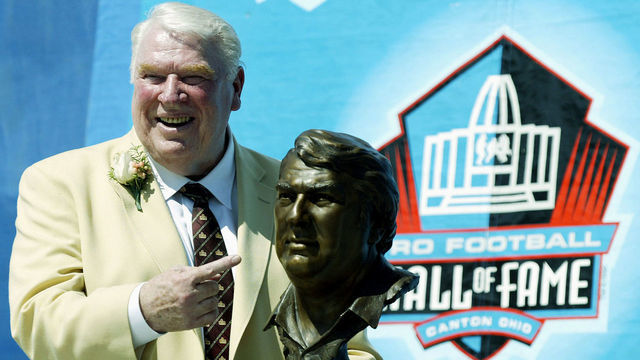 UNITED STATES - AUGUST 05: John Madden, former coach of the Oakland Raiders for 10 seasons, poses with a bust of himself during his induction into the Pro Football Hall of Fame on Saturday, August 5, 2006, in Canton, Ohio. Quarterback Troy Aikman, a member of three Super Bowl championship teams, and the late Reggie White, who's second in National Football League history with 198 career sacks, were inducted into the Pro Football Hall of Fame. Quarterback Warren Moon, linebacker Harry Carson, lineman Rayfield Wright and former coach John Madden were also enshrined during ceremonies at Fawcett Stadium in Canton, Ohio.