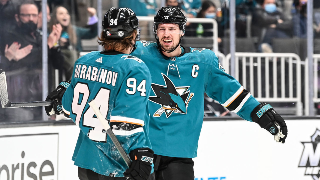 SAN JOSE, CA - DECEMBER 28: Logan Couture #39 and Alexander Barabanov #94 of the San Jose Sharks celebrate scoring a goal against the Arizona Coyotes in a regular season game at SAP Center on December 28, 2021 in San Jose, California.