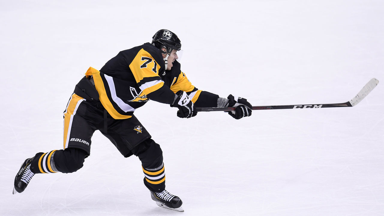 PITTSBURGH, PA - MARCH 02: Pittsburgh Penguins Center Evgeni Malkin (71) shoots the puck during the first period in the NHL game between the Pittsburgh Penguins and the Philadelphia Flyers on March 2, 2021, at PPG Paints Arena in Pittsburgh, PA.