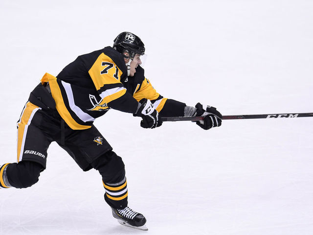 PITTSBURGH, PA - MARCH 02: Pittsburgh Penguins Center Evgeni Malkin (71) shoots the puck during the first period in the NHL game between the Pittsburgh Penguins and the Philadelphia Flyers on March 2, 2021, at PPG Paints Arena in Pittsburgh, PA.