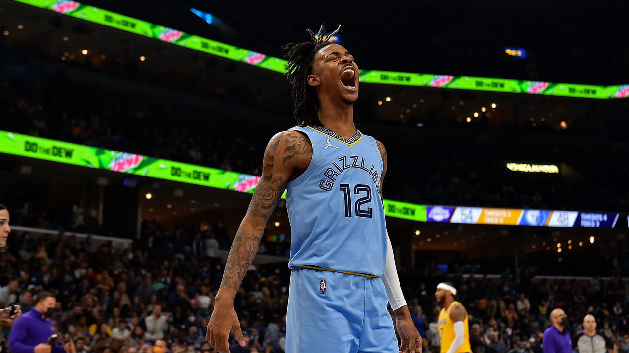 MEMPHIS, TENNESSEE - DECEMBER 29: Memphis Grizzlies guard Ja Morant #12 reacts during the first half against the Los Angeles Lakers at FedExForum on December 29, 2021 in Memphis, Tennessee.