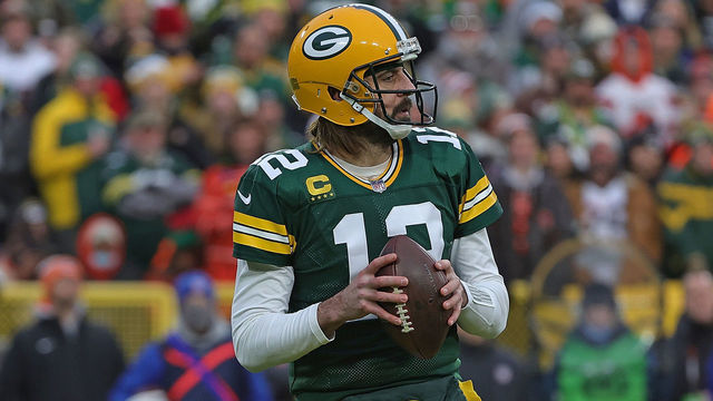 GREEN BAY, WISCONSIN - DECEMBER 25: Aaron Rodgers #12 of the Green Bay Packers drops back to pass during a game against the Cleveland Browns at Lambeau Field on December 25, 2021 in Green Bay, Wisconsin. The Packers defeated the Browns 24-22.