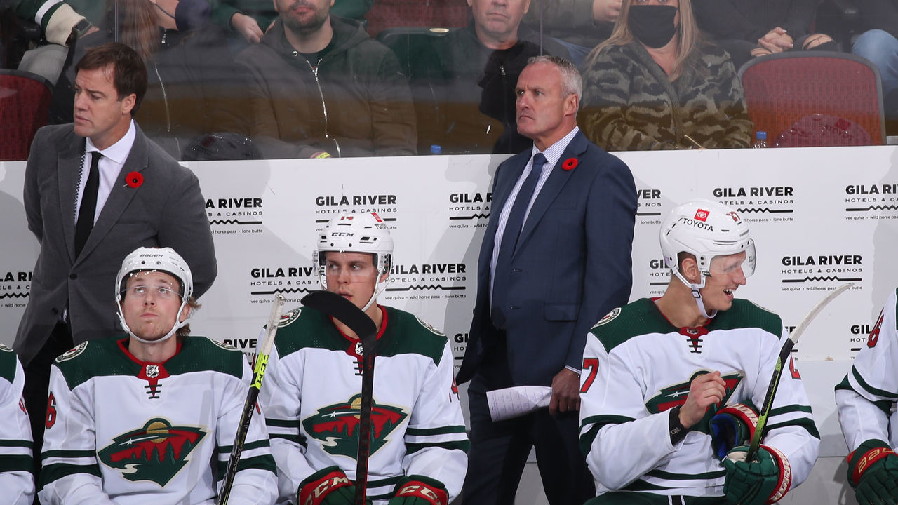 GLENDALE, ARIZONA - NOVEMBER 10: Head coach Dean Evason of the Minnesota Wild watches from the bench during the third period of the NHL game against the Arizona Coyotes at Gila River Arena on November 10, 2021 in Glendale, Arizona. The Wild defeated the Coyotes 5-2.