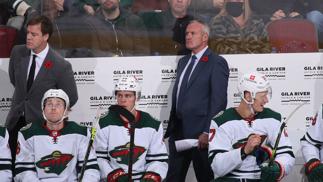 GLENDALE, ARIZONA - NOVEMBER 10: Head coach Dean Evason of the Minnesota Wild watches from the bench during the third period of the NHL game against the Arizona Coyotes at Gila River Arena on November 10, 2021 in Glendale, Arizona. The Wild defeated the Coyotes 5-2.