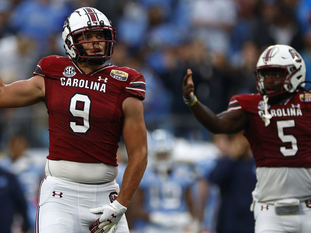 CHARLOTTE, NORTH CAROLINA - DECEMBER 30: Nick Muse #9 and Dakereon Joyner #5 of the South Carolina Gamecocks react following a play during the first half of the Duke's Mayo Bowl against the North Carolina Tar Heels at Bank of America Stadium on December 30, 2021 in Charlotte, North Carolina.