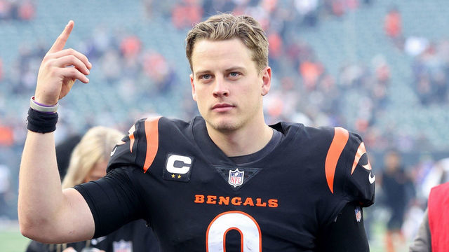 CINCINNATI, OHIO - DECEMBER 26: Joe Burrow #9 of the Cincinnati Bengals walks off the field after a win over the Baltimore Ravens at Paul Brown Stadium on December 26, 2021 in Cincinnati, Ohio.