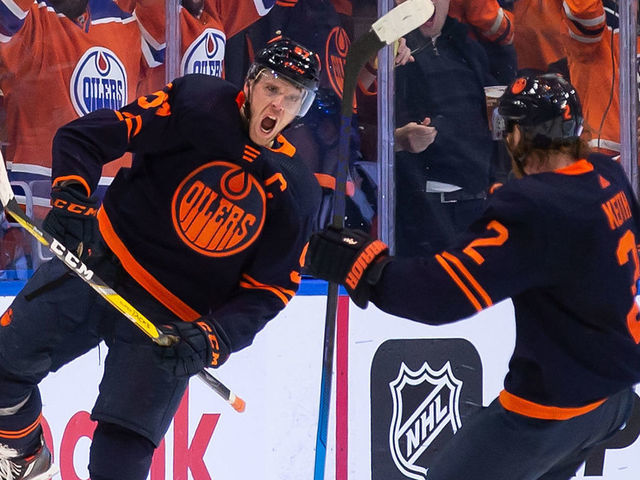 EDMONTON, AB - NOVEMBER 18: Connor McDavid #97 and Duncan Keith #2 of the Edmonton Oilers celebrate a goal against the Winnipeg Jets during the third period at Rogers Place on November 18, 2021 in Edmonton, Canada.