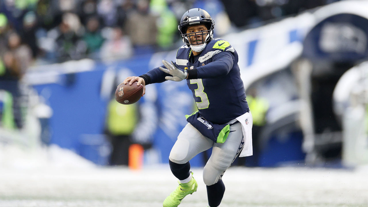 SEATTLE, WASHINGTON - DECEMBER 26: Russell Wilson #3 of the Seattle Seahawks looks to pass against the Chicago Bears during the third quarter at Lumen Field on December 26, 2021 in Seattle, Washington.