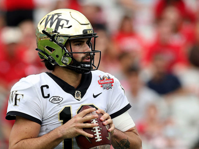 JACKSONVILLE, FLORIDA - DECEMBER 31: Sam Hartman #10 of the Wake Forest Demon Deacons looks to pass against the Rutgers Scarlet Knights during the TaxSlayer Gator Bowl at TIAA Bank Field on December 31, 2021 in Jacksonville, Florida.