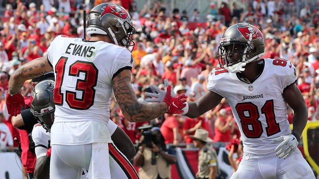 TAMPA, FL - OCTOBER 10: Tampa Bay Buccaneers Wide Receiver Mike Evans (13) is congratulated for scoring a touchdown by Antonio Brown (81) during the regular season game between the Miami Dolphins and the Tampa Bay Buccaneers on October 10, 2021 at Raymond James Stadium in Tampa, Florida.