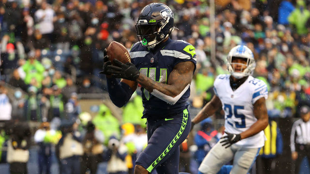 SEATTLE, WASHINGTON - JANUARY 02: DK Metcalf #14 of the Seattle Seahawks catches the ball for a touchdown during the second quarter against the Detroit Lions at Lumen Field on January 02, 2022 in Seattle, Washington.
