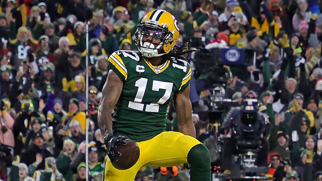GREEN BAY, WISCONSIN - DECEMBER 25: Davante Adams #17 of the Green Bay Packers celebrates a touchdown during a game against the Cleveland Browns at Lambeau Field on December 25, 2021 in Green Bay, Wisconsin. The Packers defeated the Browns 24-22.