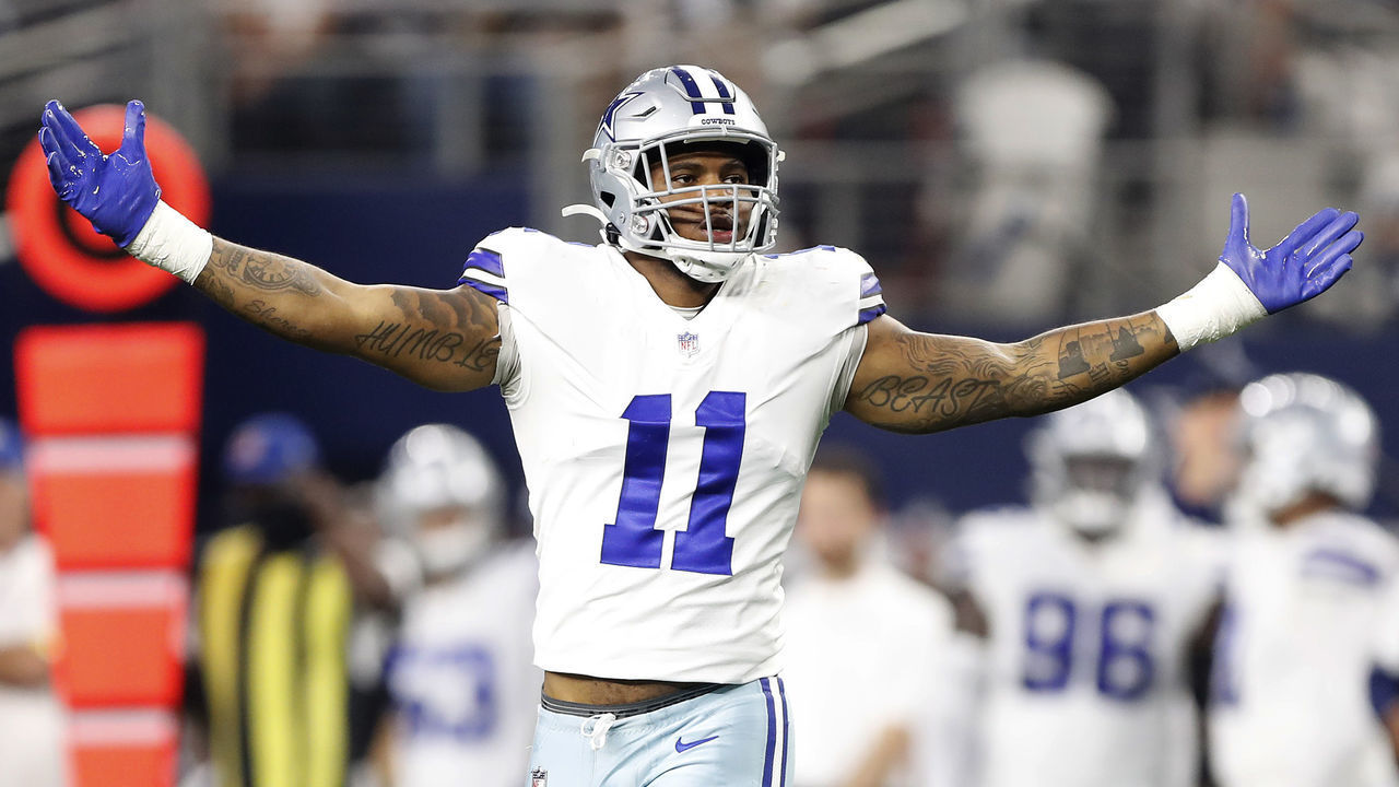 ARLINGTON, TEXAS - DECEMBER 26: Micah Parsons #11 of the Dallas Cowboys celebrates after a sack during the second half against the Washington Football Team at AT&T Stadium on December 26, 2021 in Arlington, Texas.